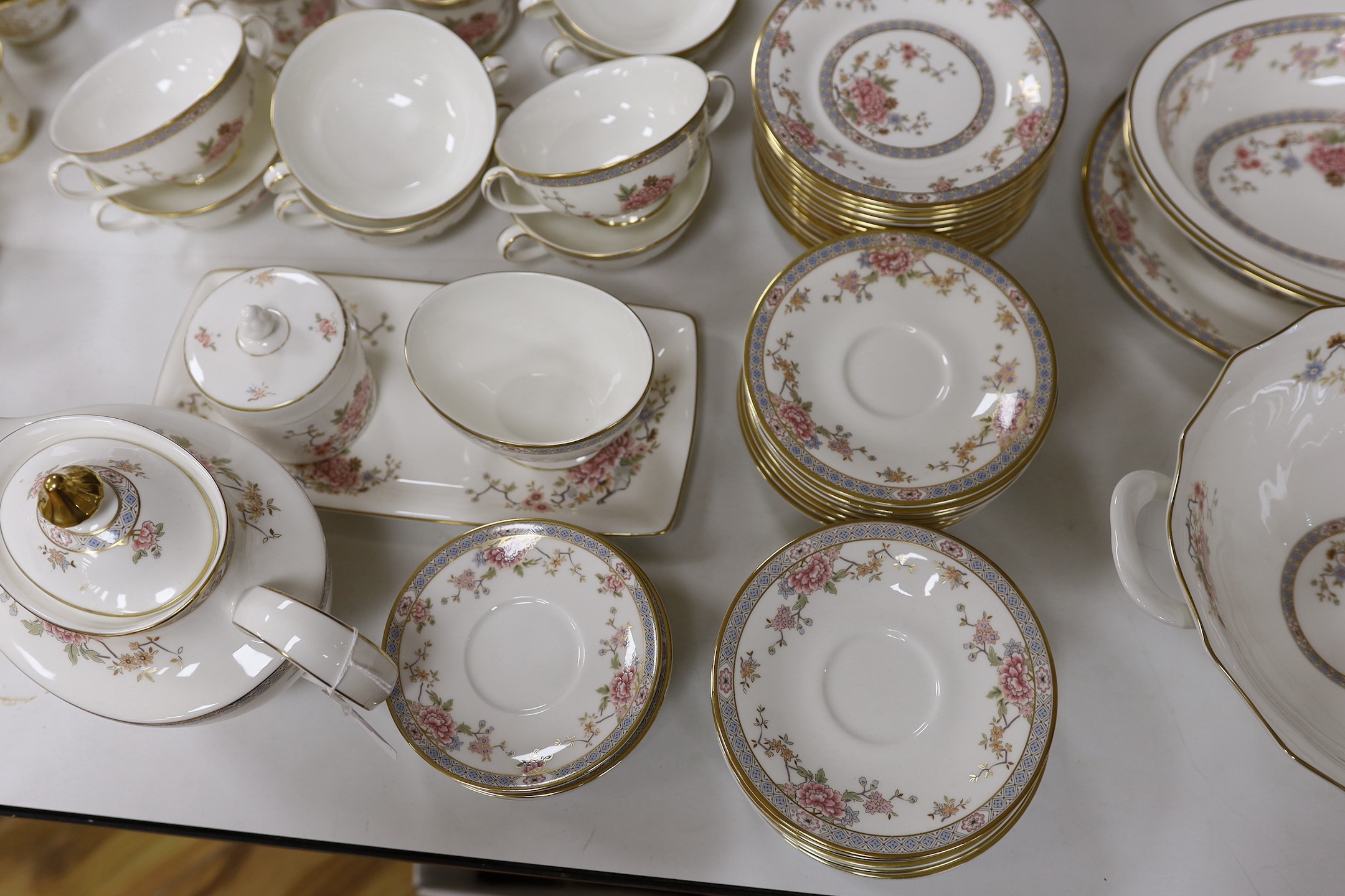 An extensive Royal Doulton Canton pattern dinner service as used by The Queen and Paddington bear in the Jubilee sketch